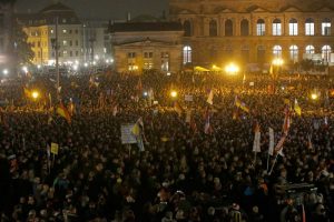 People gather for an anti-immigration demonstration organised by rightwing movement Patriotic Europeans Against the Islamisation of the West (PEGIDA) in Dresden, Germany October 19, 2015. PEGIDA held a rally on Monday to mark the one-year anniversary of the group's formation. REUTERS/Fabrizio Bensch